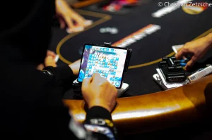 Is a cell phone ban the answer to major poker cheating allegations?